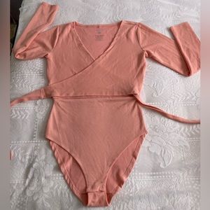 hi :) i am selling this super cute South Beach pink unused bodysuit